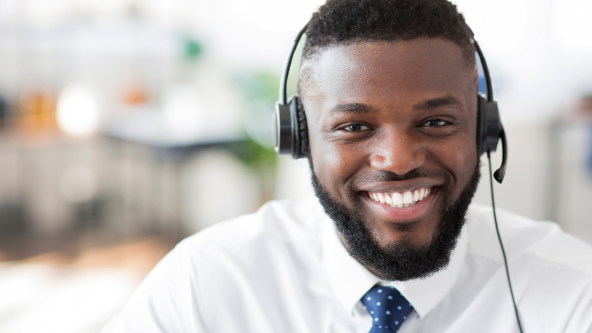 Close up of a male customer service representative wearing a headset